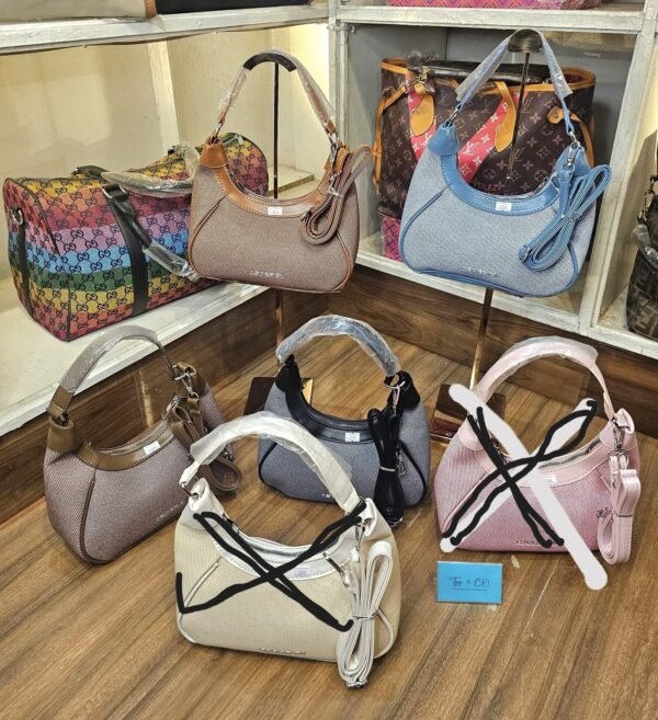 Fashionable Imported shoulder hands bag with long belt .
